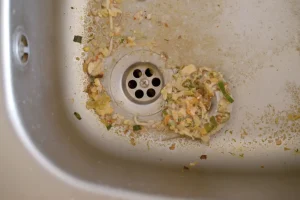 Close up on dirty clogging kitchen sink drain