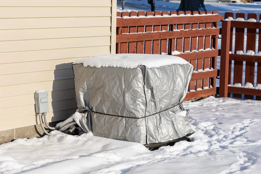 Covering heat pump from snow to protect the coil condenser